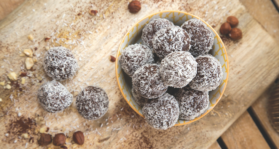 Jo’s Absolute Nutrition protein balls in a bowl on a wooden table